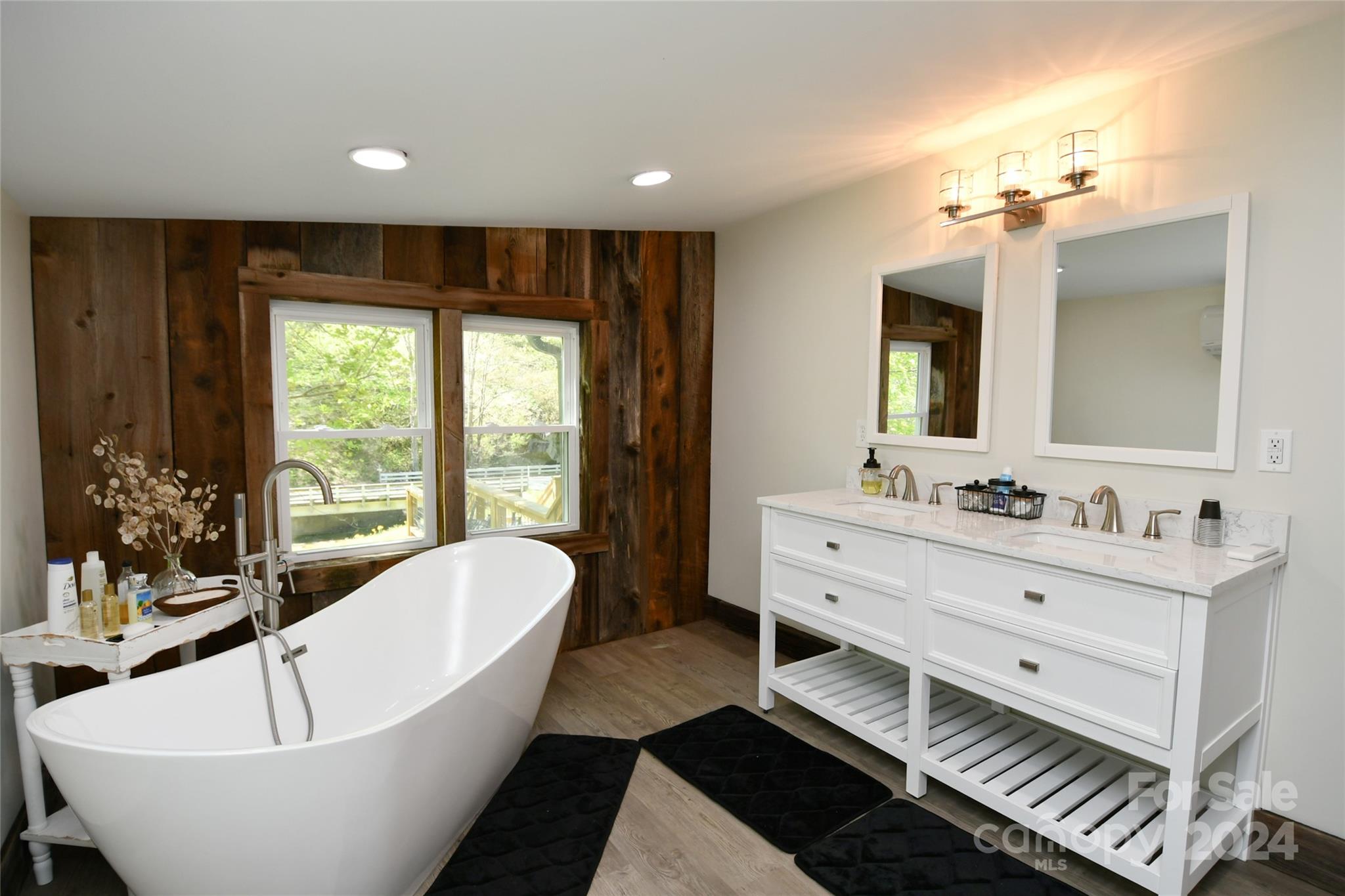 2180 Pigeon Roost Road Green Mountain, NC 28740 - Photo 16 of 47 a spacious bathroom with a large tub sink and mirror
