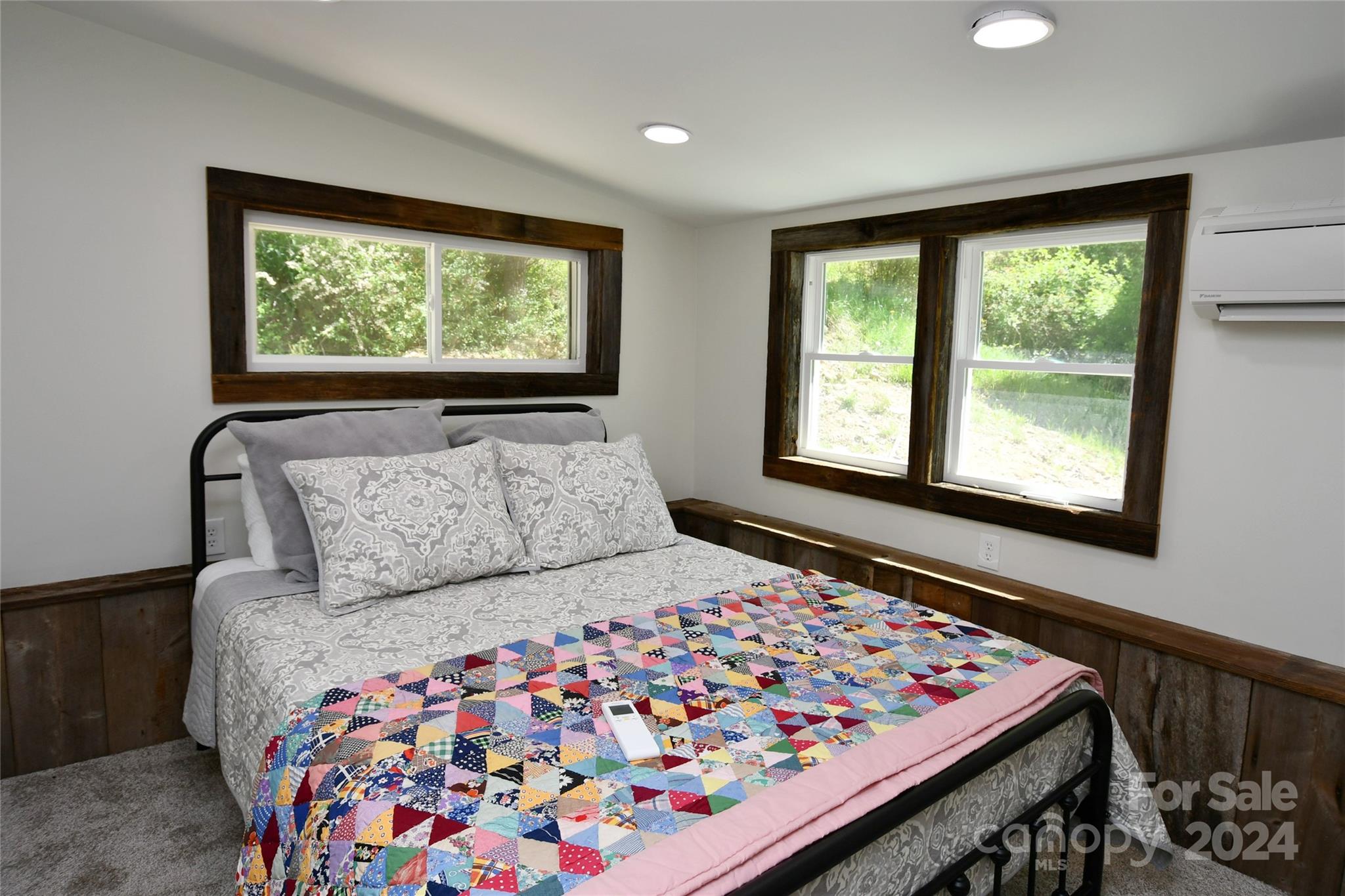 2180 Pigeon Roost Road Green Mountain, NC 28740 - Photo 18 of 47 a bedroom with a large bed and a window
