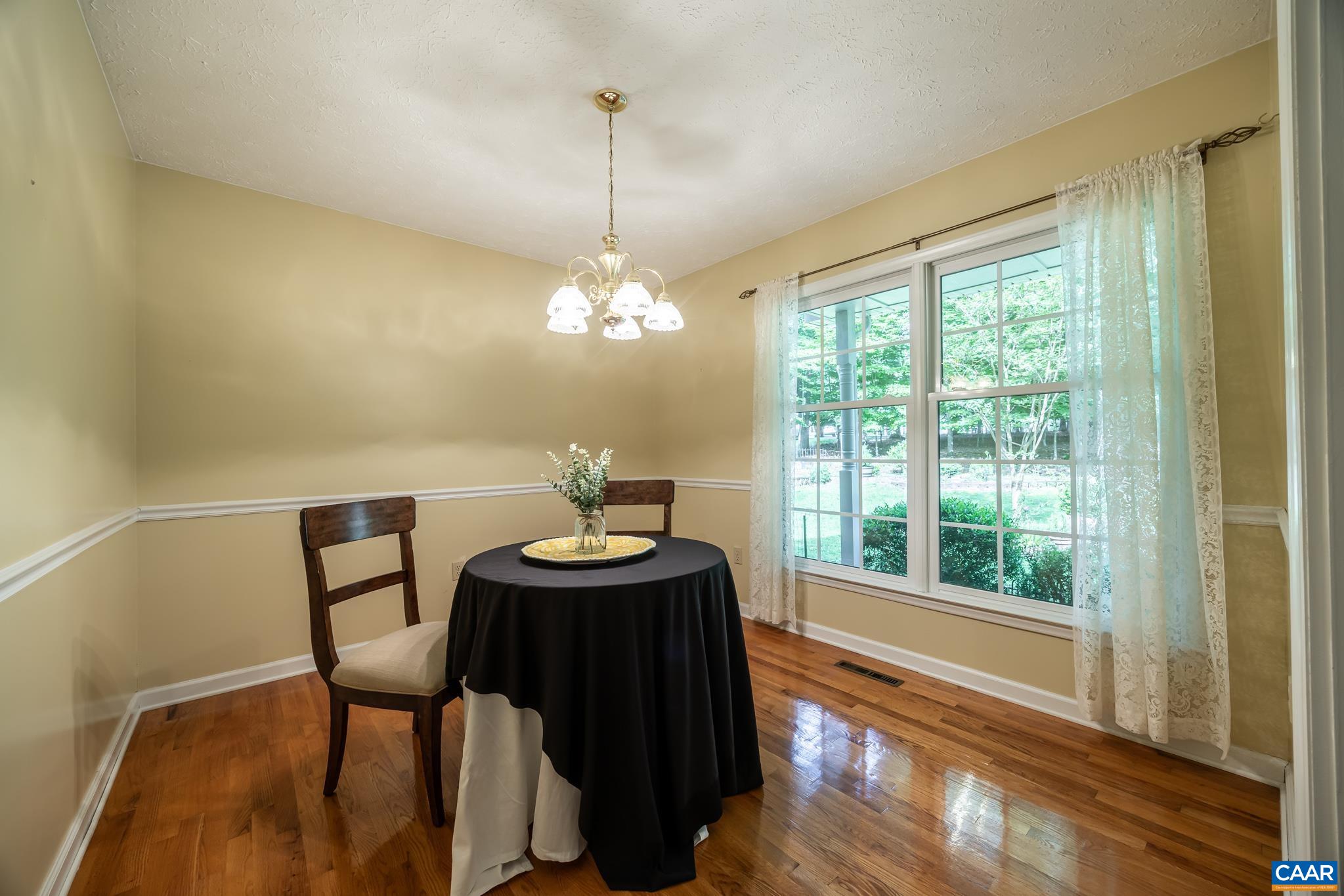 3 Condor Road Palmyra, VA 22963 - Photo 8 of 50 a view of a dining room with furniture a chandelier and wooden floor