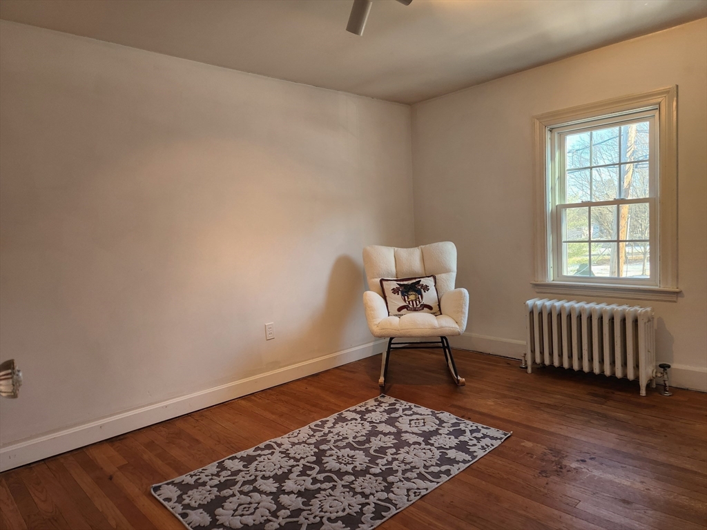350 Thompson Road Webster, MA 01570 - Photo 24 of 41 a living room with a couch and a rug