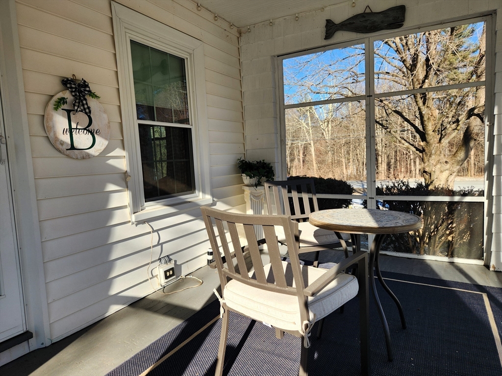 350 Thompson Road Webster, MA 01570 - Photo 29 of 41 a view of a dining room with furniture window and outside view