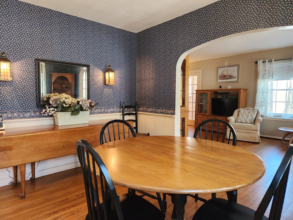 350 Thompson Road Webster, MA 01570 - Photo 3 of 41 a view of a dining room with furniture and wooden floor