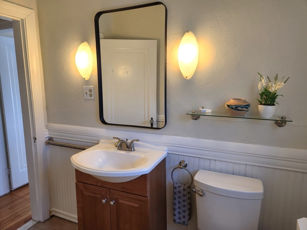 350 Thompson Road Webster, MA 01570 - Photo 9 of 41 a bathroom with a toilet sink and mirror