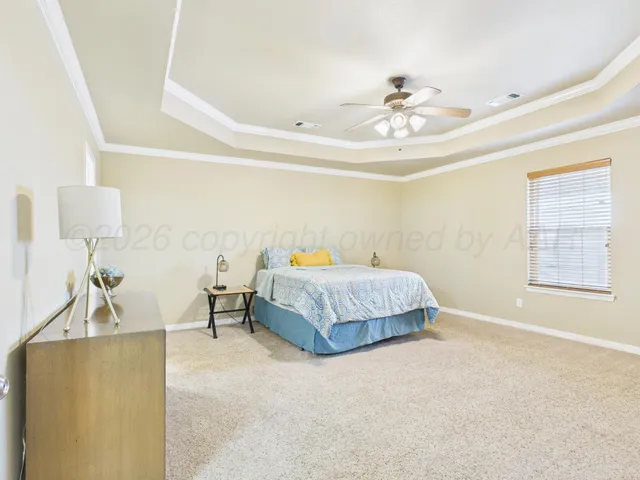 a bedroom with a bed and couch