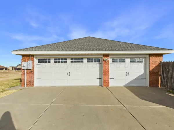 a front view of a house with a garage