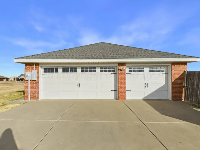 a front view of a house with a garage