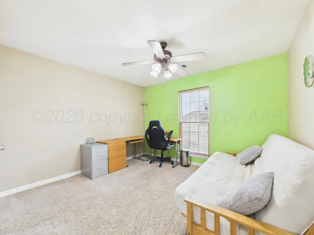 a living room with furniture and a rug