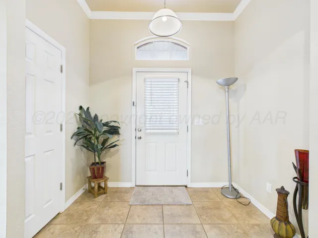 a living room with furniture a fireplace and a chandelier
