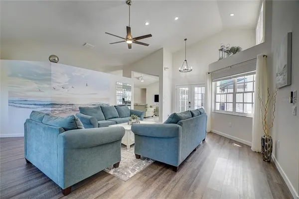 a living room with furniture and a large window