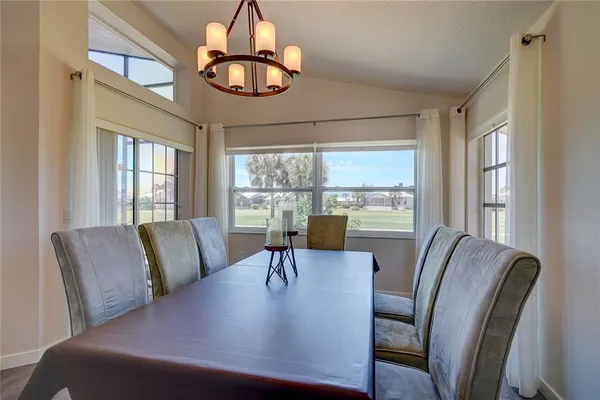 a view of a dining room with furniture window and outside view