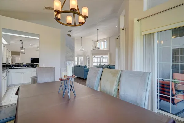 a living room with furniture and kitchen view