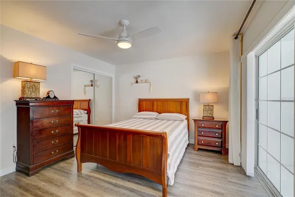 a bedroom with a bed and a dresser