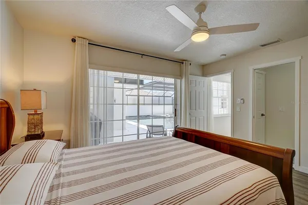 a bedroom with a large bed and a large window