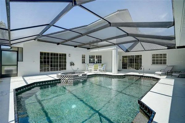 a view of a house with backyard and garden