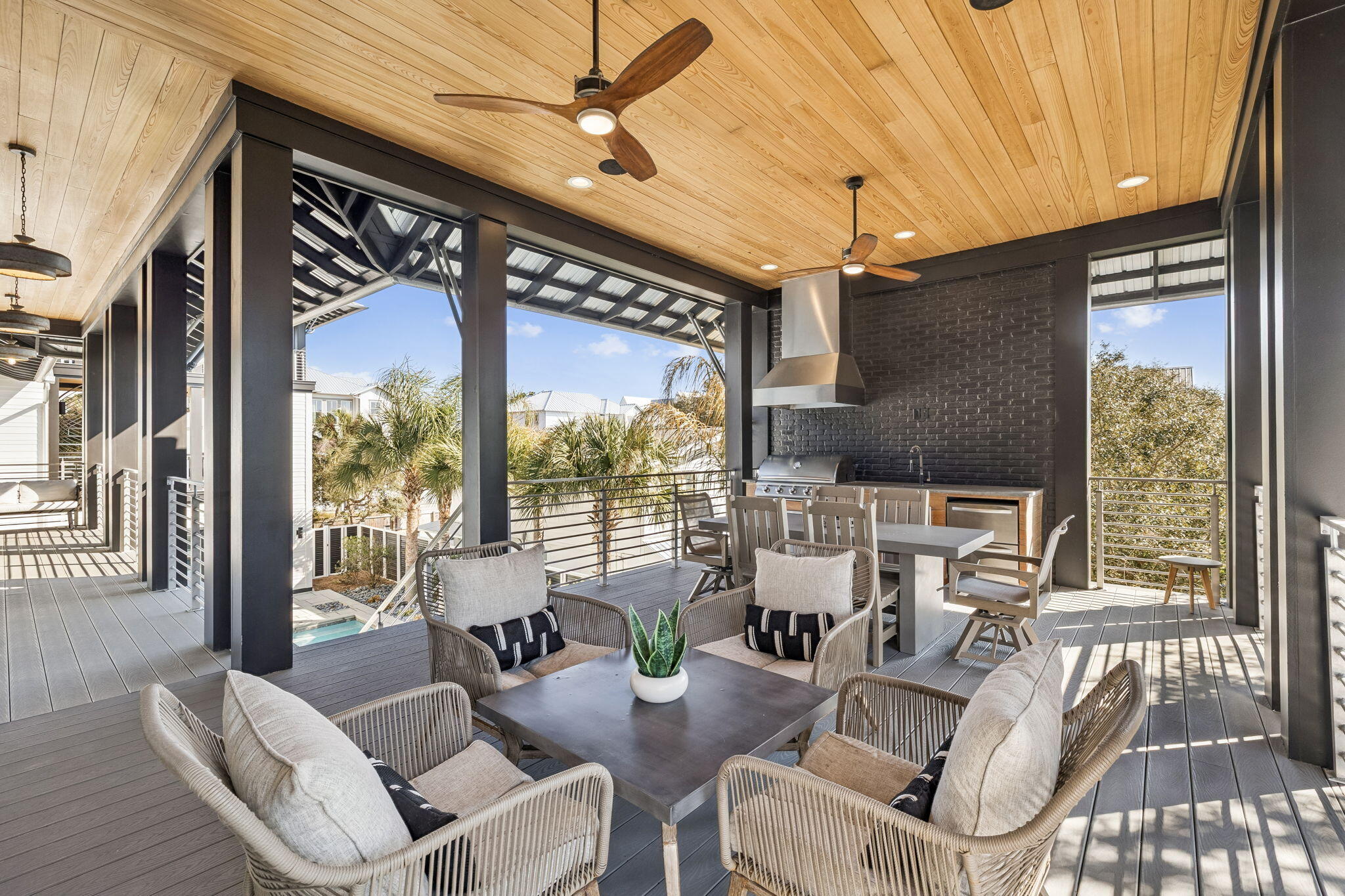 124 Hilltop Drive Santa Rosa Beach, FL 32459 - Photo 14 of 65 a view of a dining room with furniture a chandelier and wooden floor