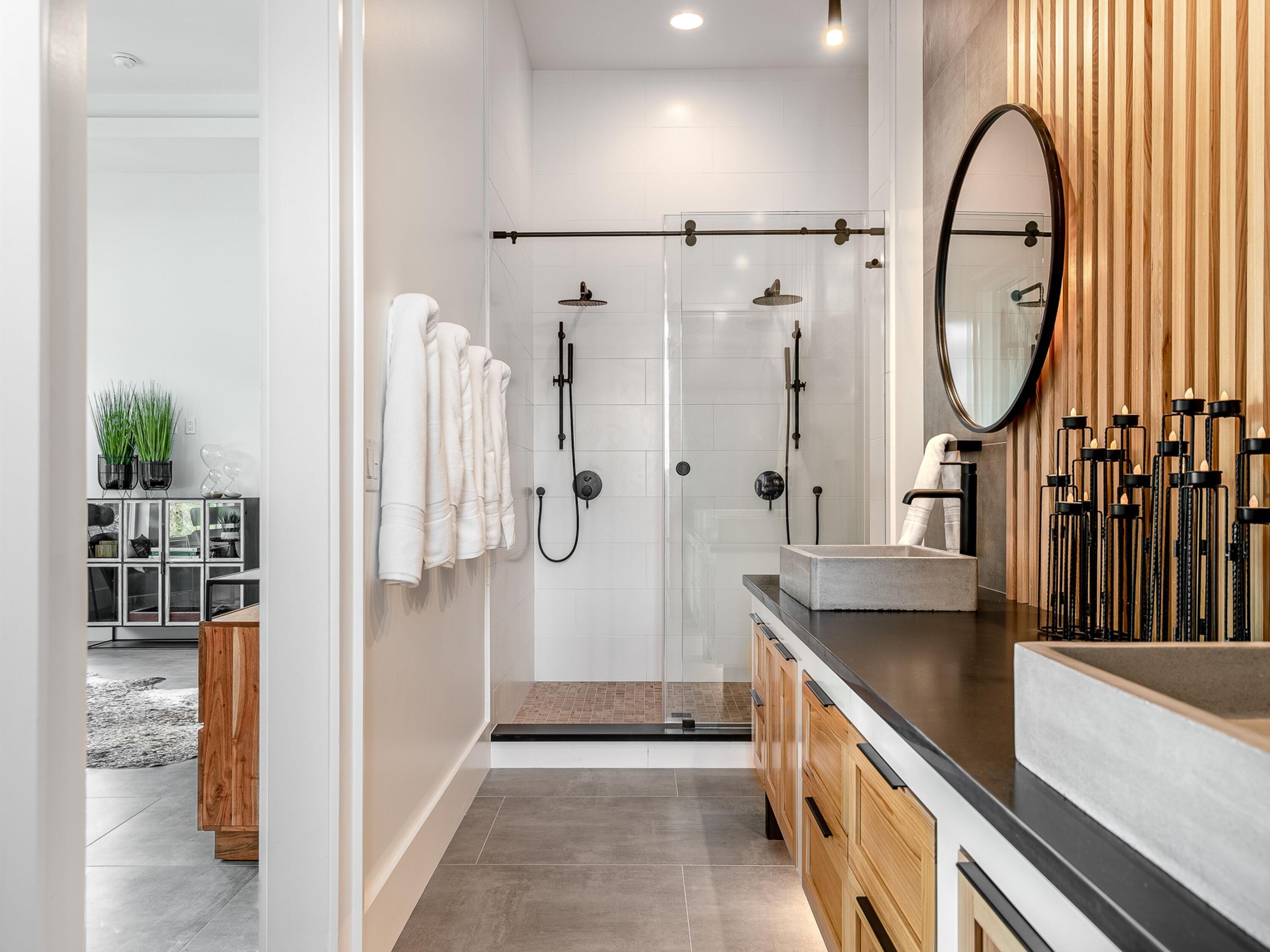 124 Hilltop Drive Santa Rosa Beach, FL 32459 - Photo 20 of 65 a bathroom with a granite countertop sink a mirror and a shower