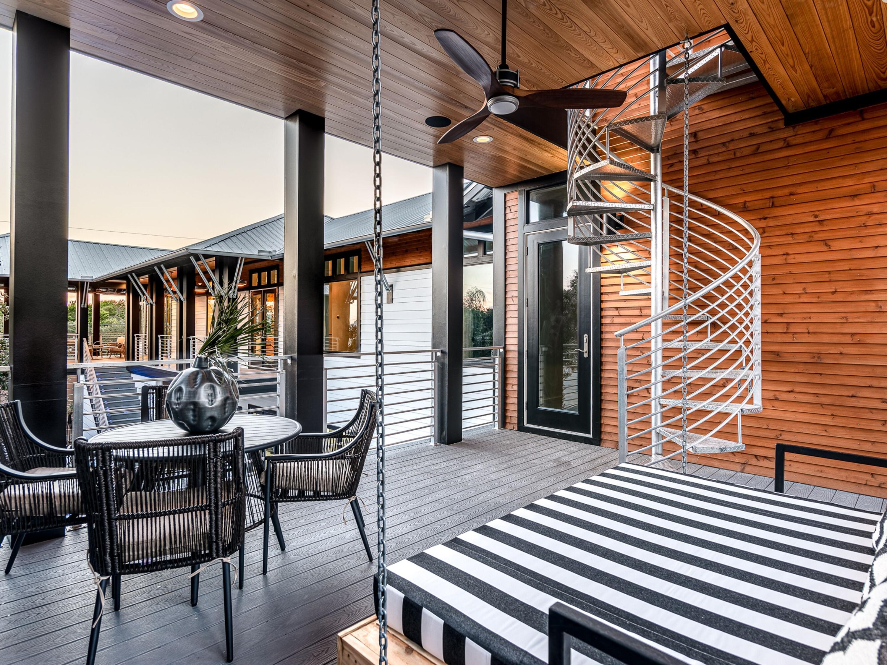 124 Hilltop Drive Santa Rosa Beach, FL 32459 - Photo 24 of 65 a view of a patio with table and chairs and wooden floor