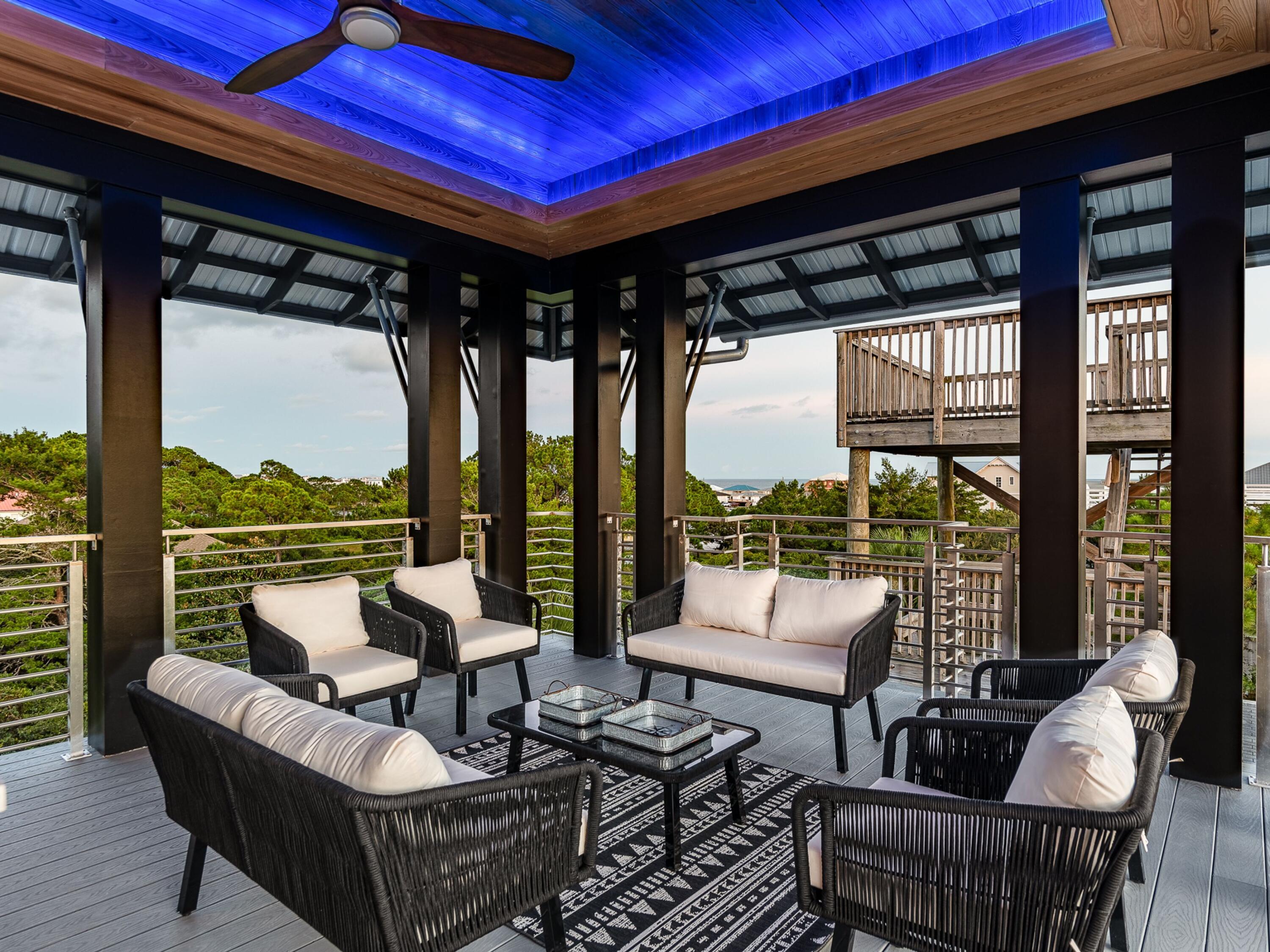 124 Hilltop Drive Santa Rosa Beach, FL 32459 - Photo 25 of 65 a roof deck with couches and potted plants