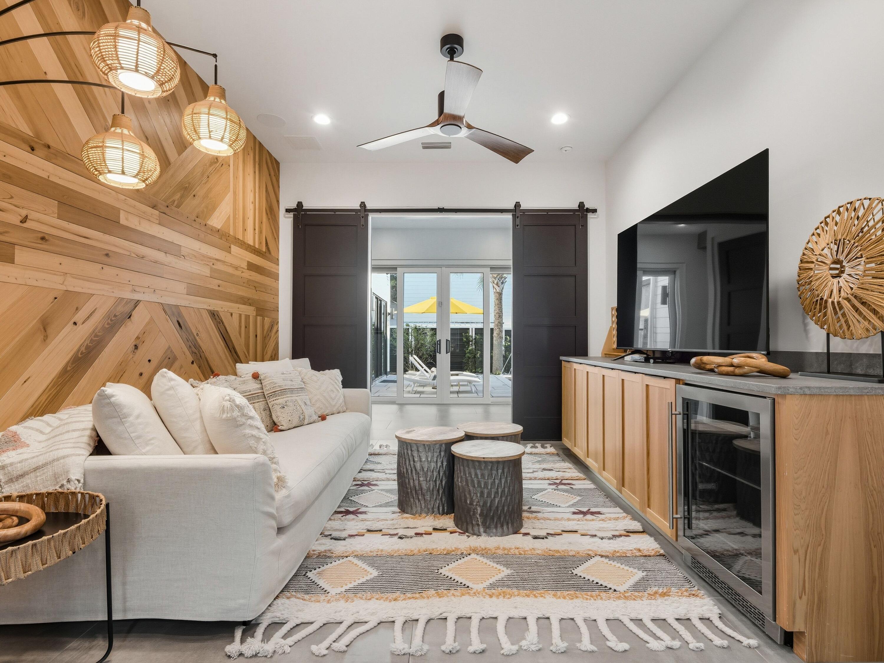 124 Hilltop Drive Santa Rosa Beach, FL 32459 - Photo 30 of 65 a living room with furniture and a flat screen tv