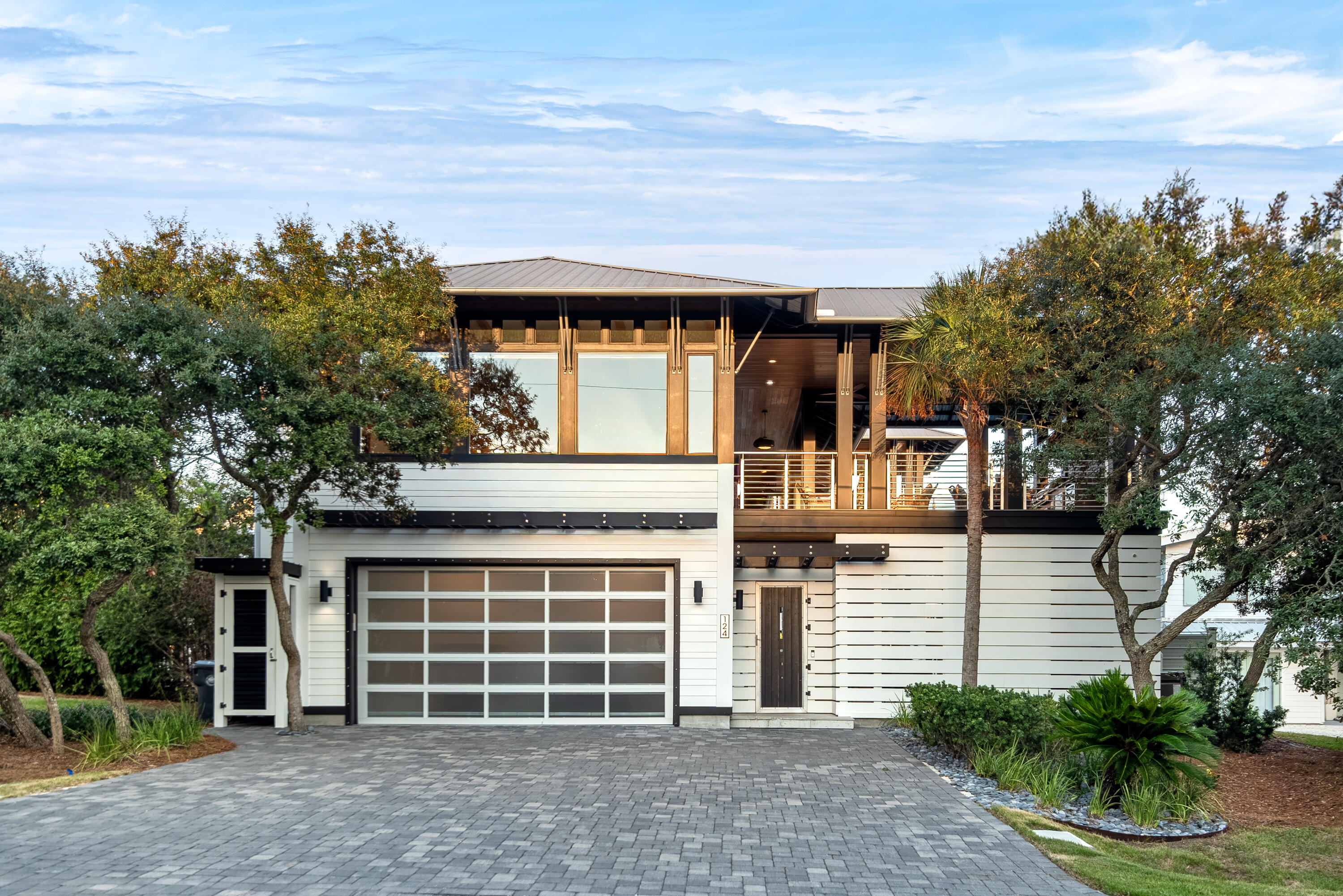 124 Hilltop Drive Santa Rosa Beach, FL 32459 - Photo 3 of 65 a front view of a house with a yard and garage