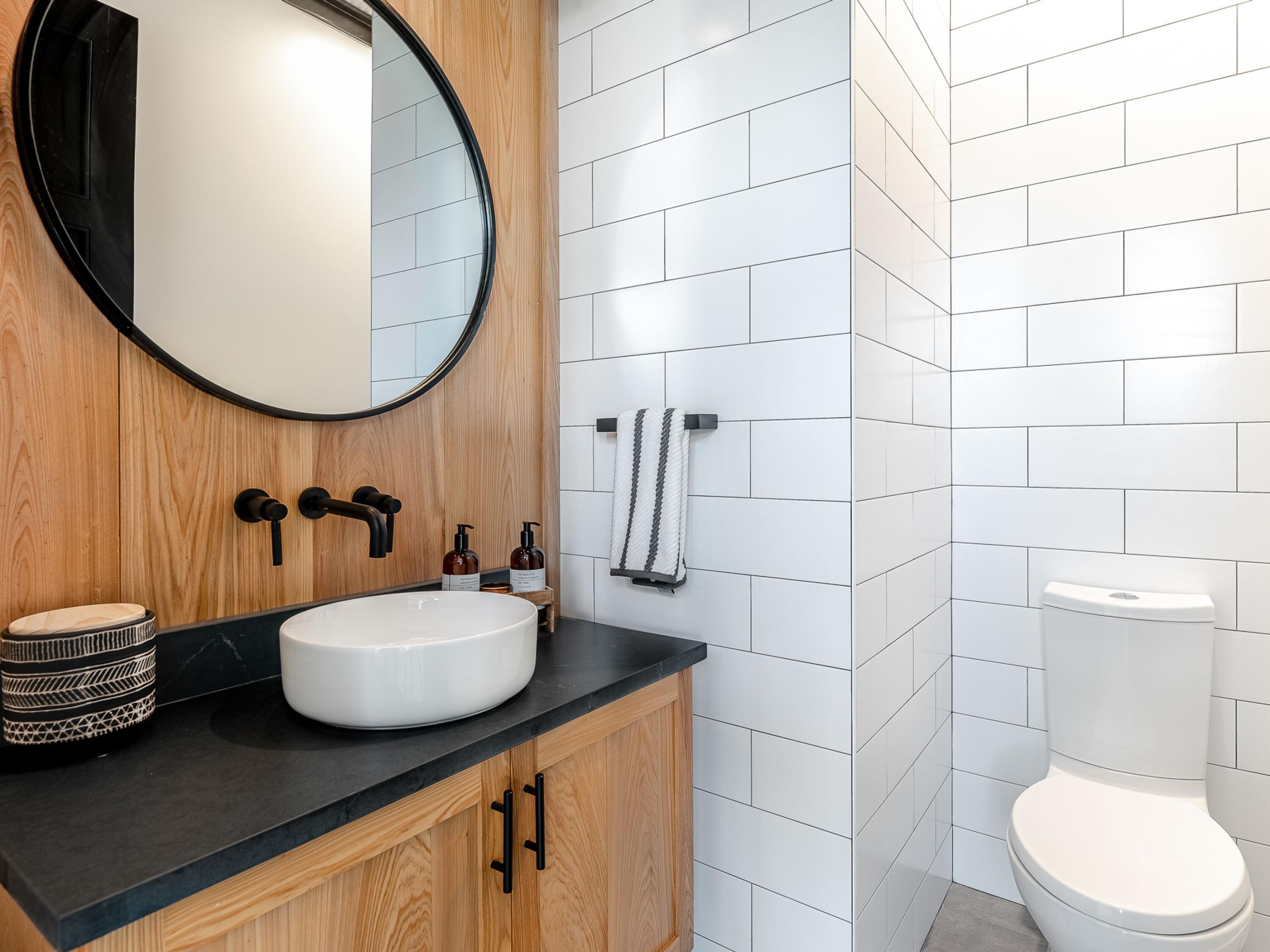 124 Hilltop Drive Santa Rosa Beach, FL 32459 - Photo 33 of 65 a bathroom with a sink toilet and a mirror
