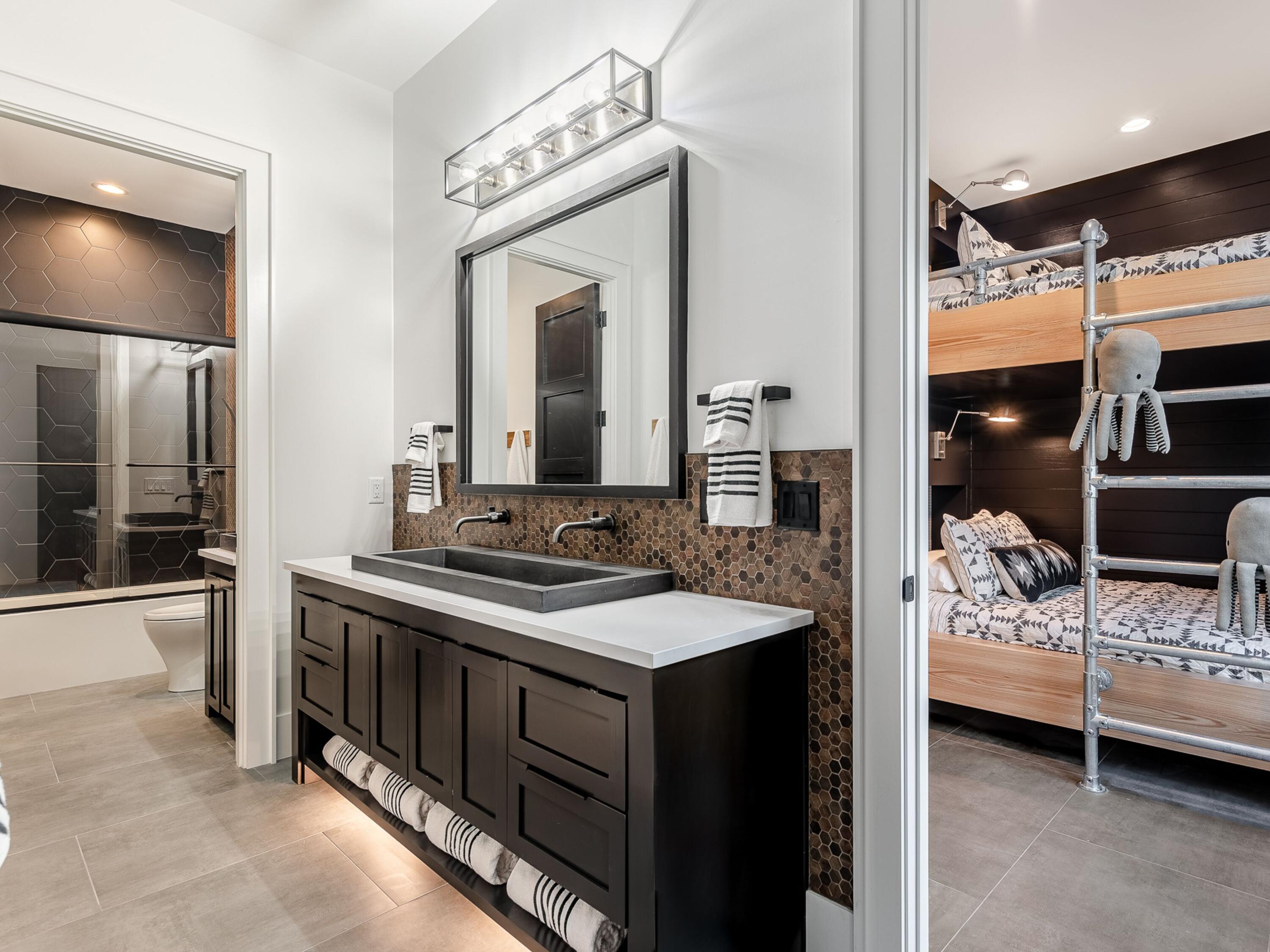 124 Hilltop Drive Santa Rosa Beach, FL 32459 - Photo 39 of 65 a en suite bathroom with double vanity and a mirror