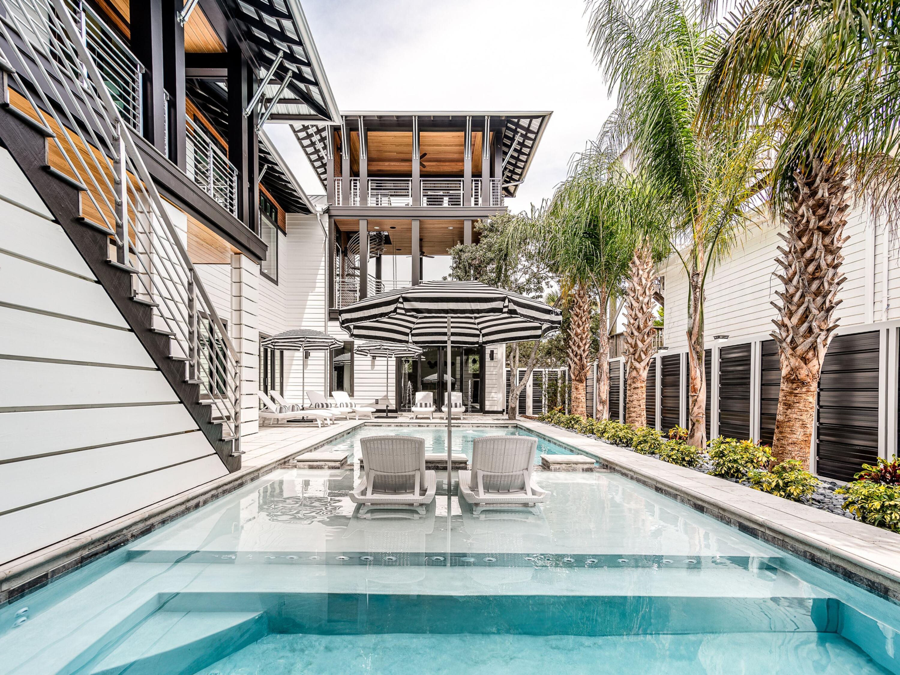 124 Hilltop Drive Santa Rosa Beach, FL 32459 - Photo 4 of 65 a view of a house with wooden deck and furniture