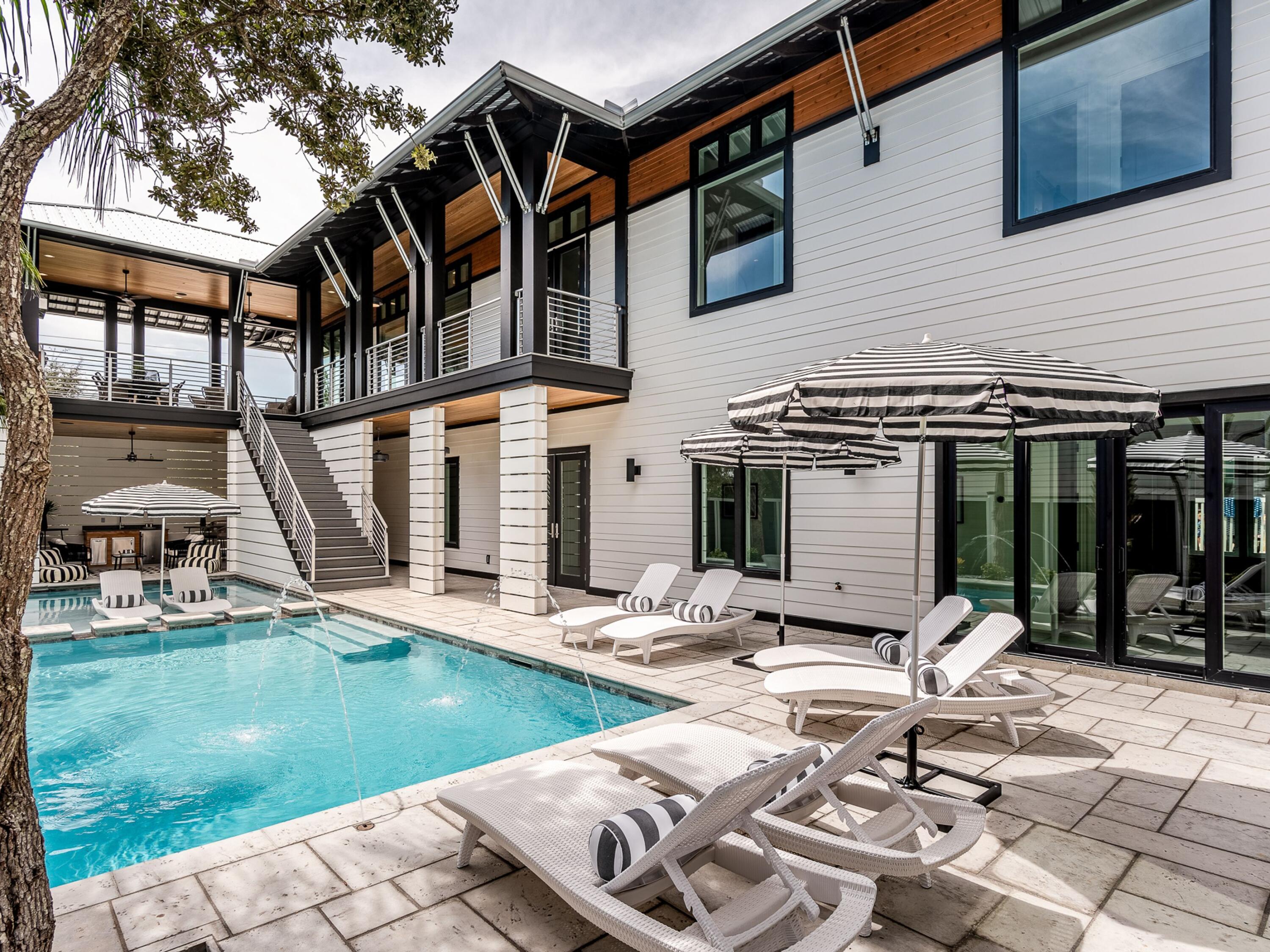 124 Hilltop Drive Santa Rosa Beach, FL 32459 - Photo 56 of 65 a front view of a house with swimming pool