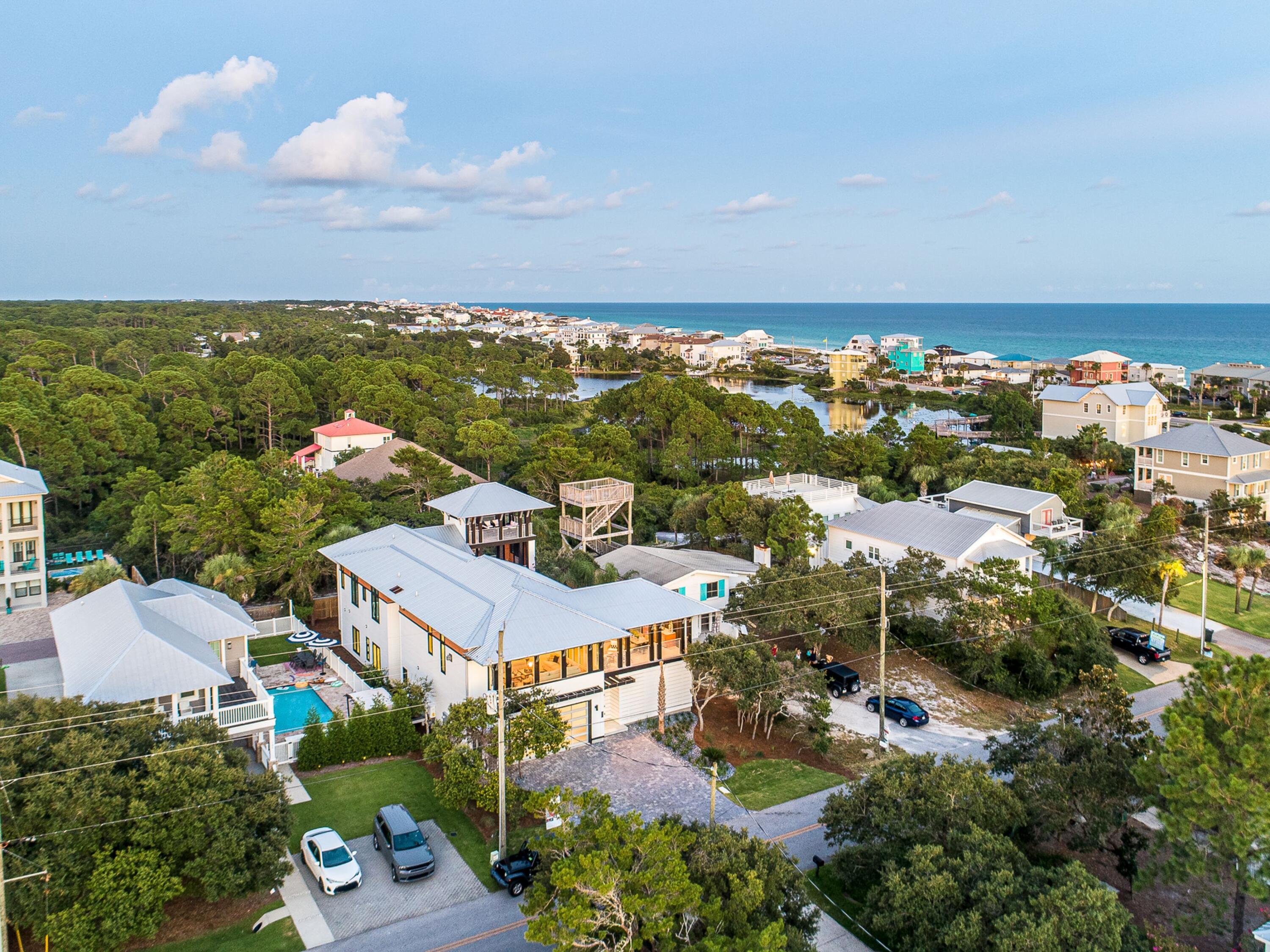 124 Hilltop Drive Santa Rosa Beach, FL 32459 - Photo 57 of 65 an aerial view of a house with a lake view