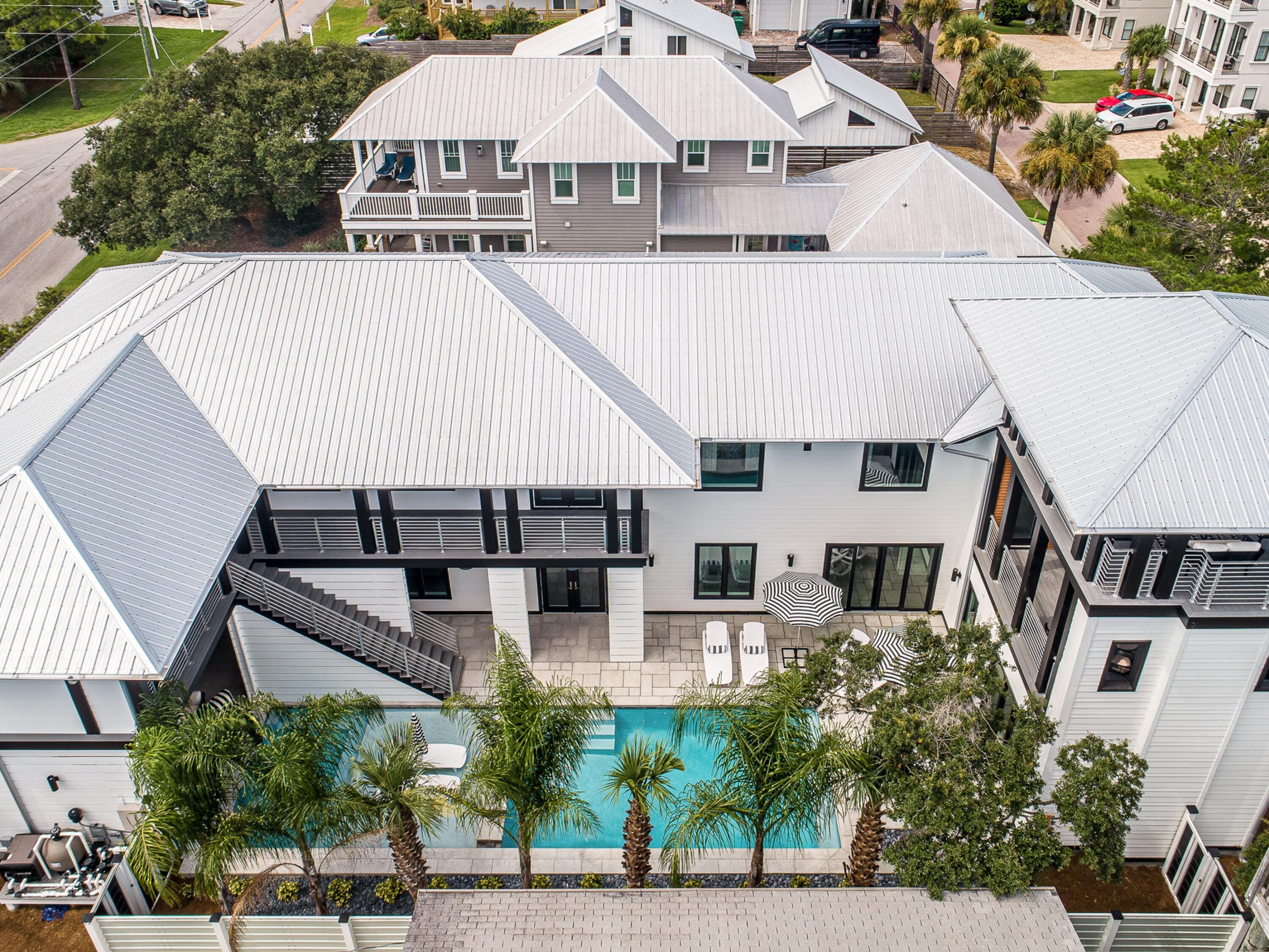 124 Hilltop Drive Santa Rosa Beach, FL 32459 - Photo 60 of 65 an aerial view of a house with a yard and potted plants