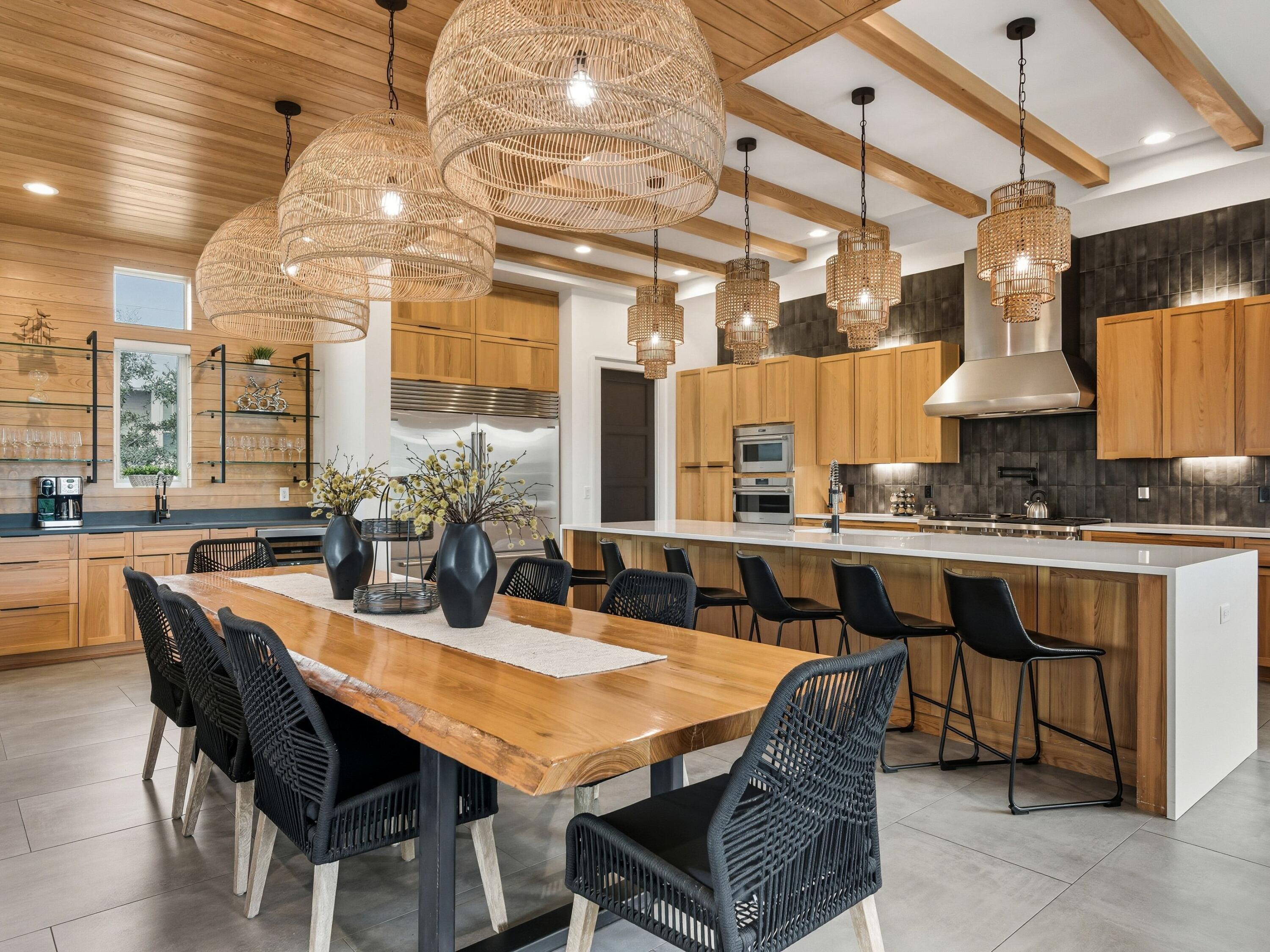 124 Hilltop Drive Santa Rosa Beach, FL 32459 - Photo 7 of 65 a dining room with stainless steel appliances kitchen island a table and chairs