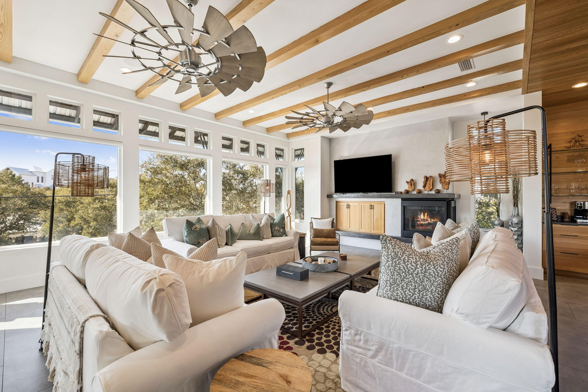 124 Hilltop Drive Santa Rosa Beach, FL 32459 - Photo 10 of 65 a living room with furniture a flat screen tv and a chandelier