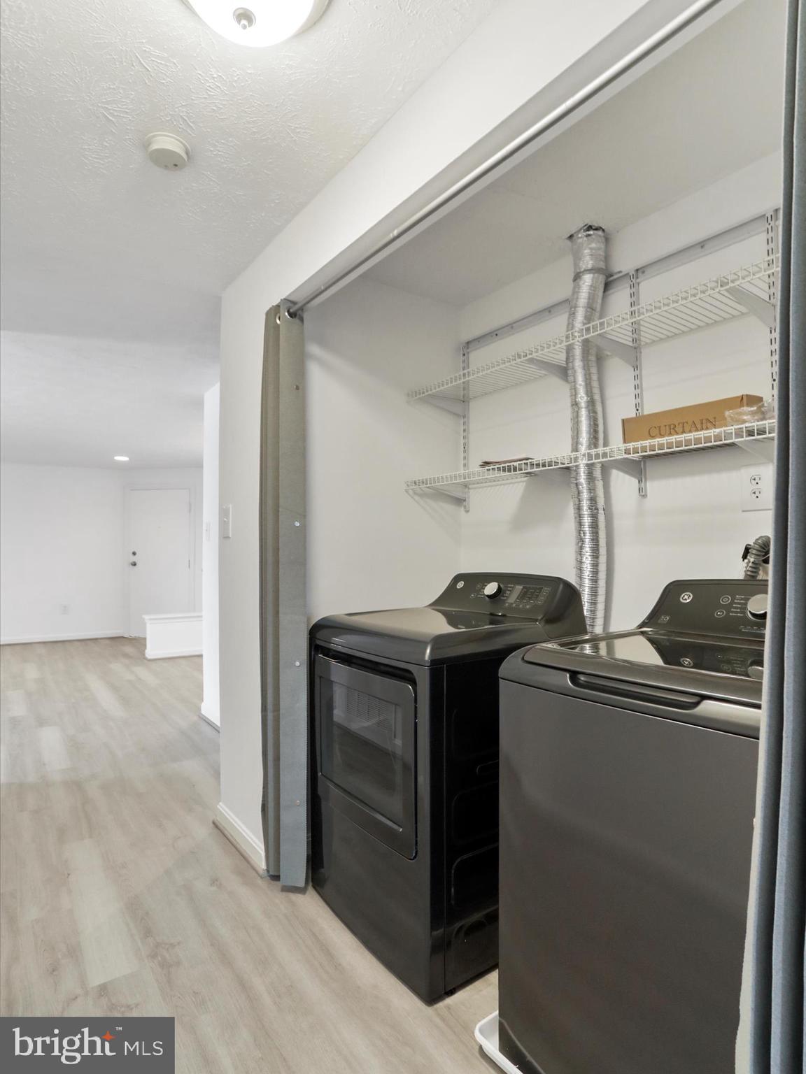 811 Stratford Way, Unit D Frederick, MD 21701 - Photo 12 of 25 a kitchen with stainless steel appliances granite countertop a refrigerator and a stove