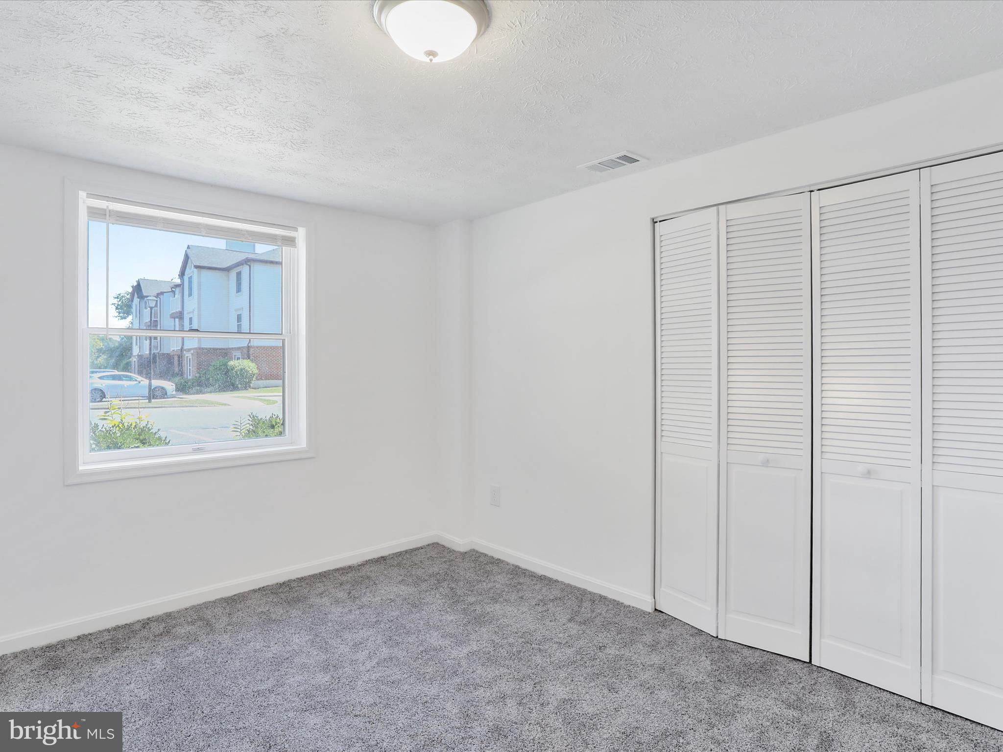 811 Stratford Way, Unit D Frederick, MD 21701 - Photo 15 of 25 a view of an empty room with a window