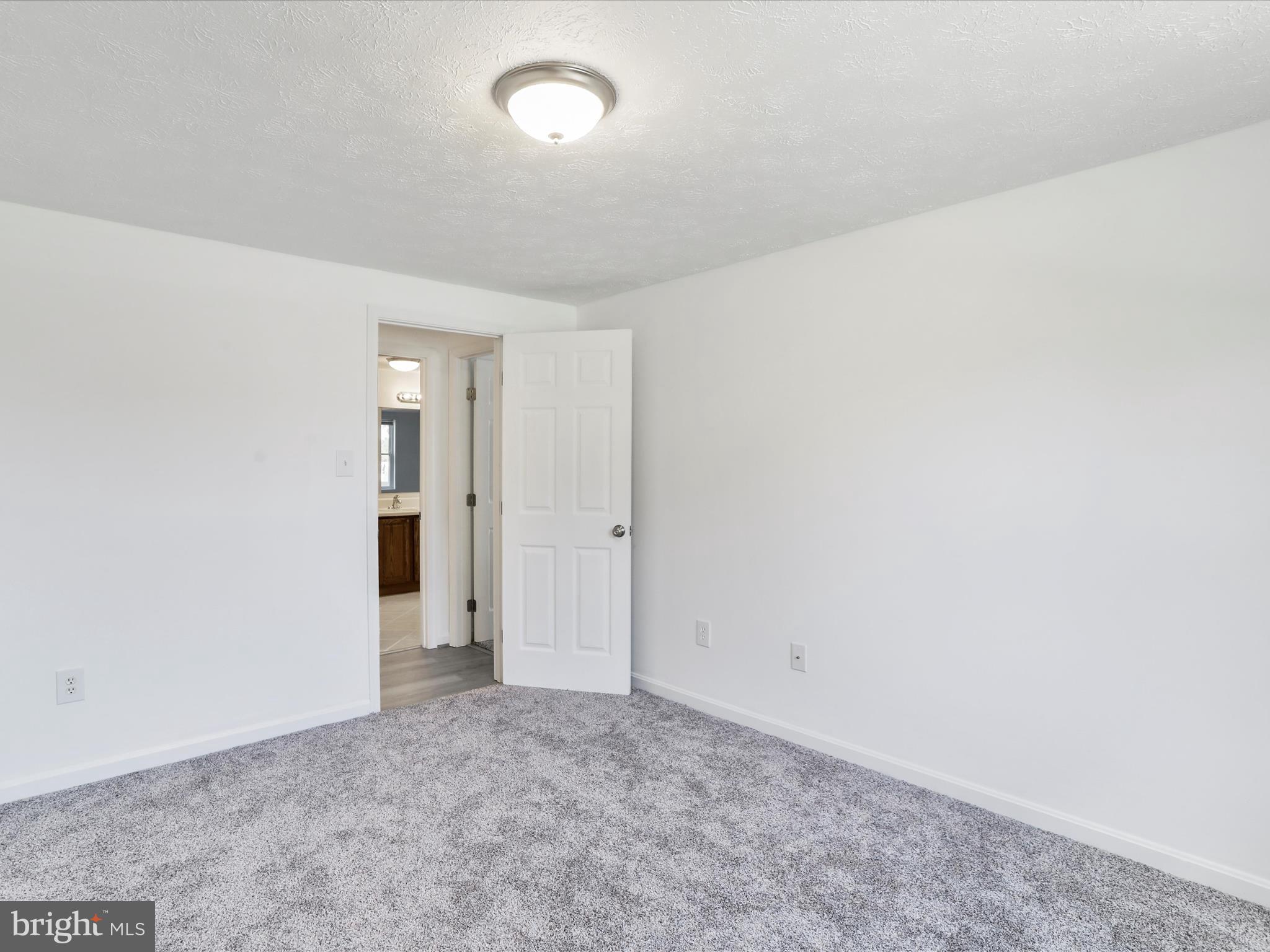 811 Stratford Way, Unit D Frederick, MD 21701 - Photo 16 of 25 an empty room with an entryway