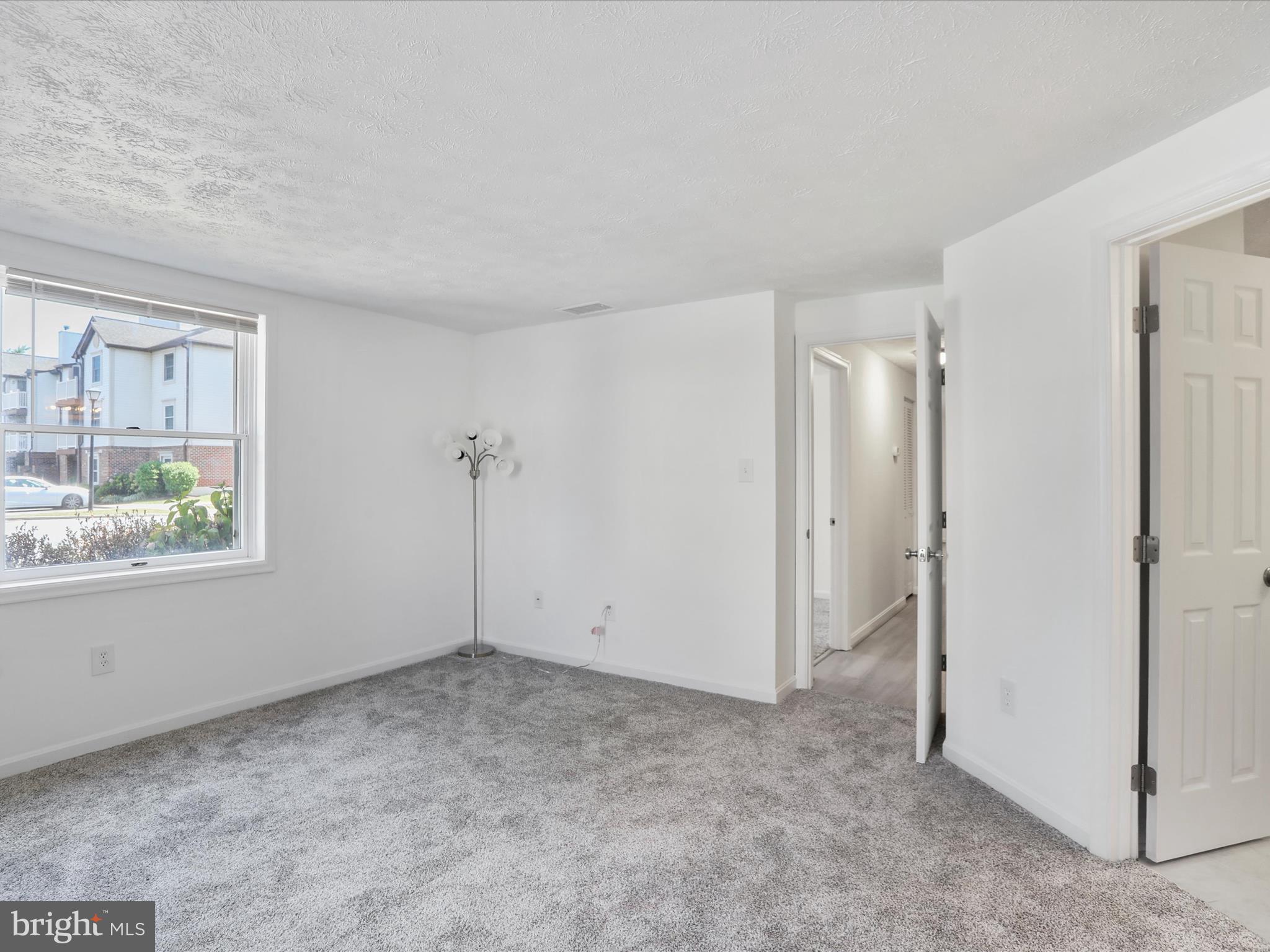 811 Stratford Way, Unit D Frederick, MD 21701 - Photo 19 of 25 a view of an empty room with a window
