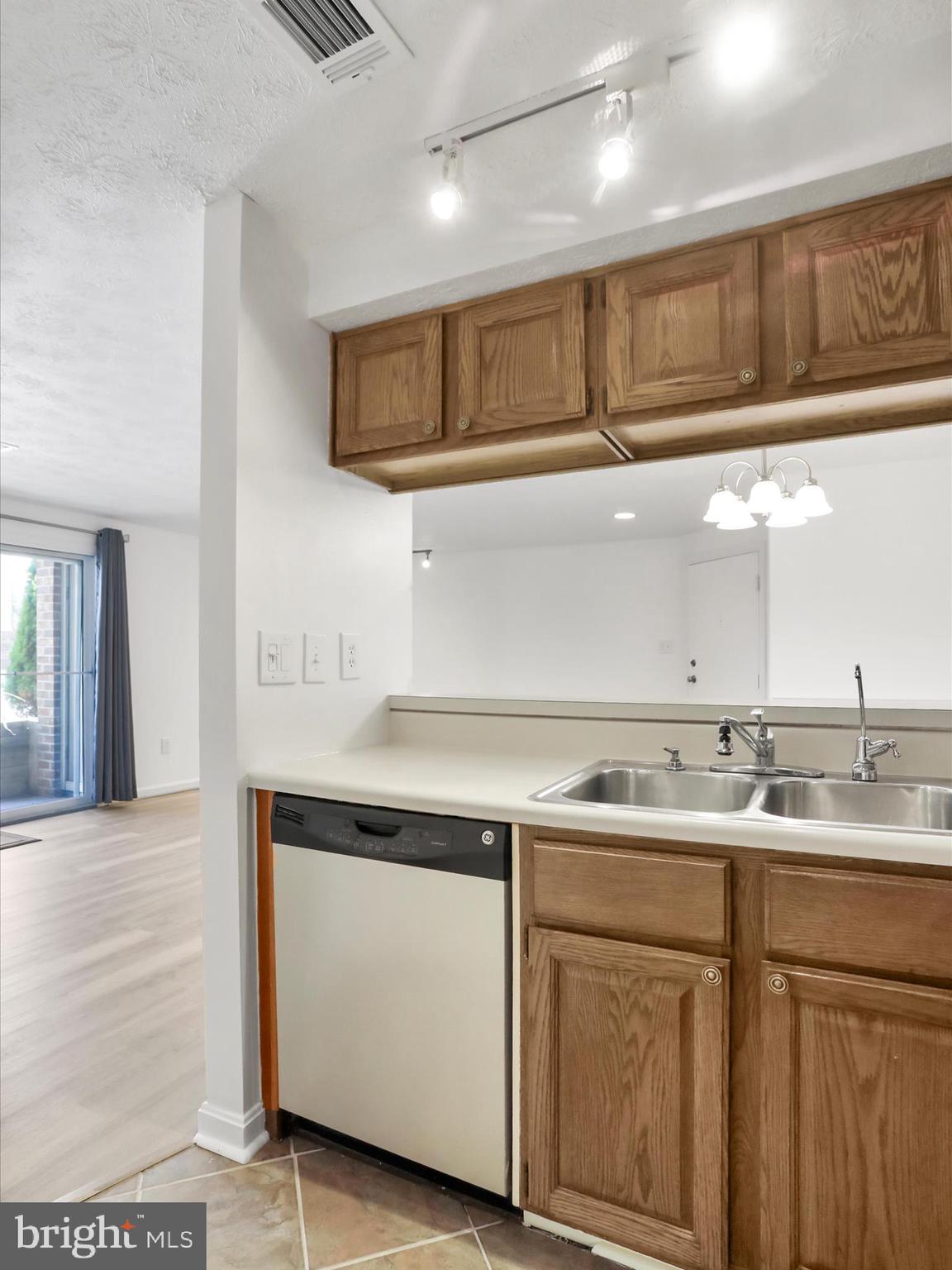 811 Stratford Way, Unit D Frederick, MD 21701 - Photo 5 of 25 a kitchen with a sink and cabinets