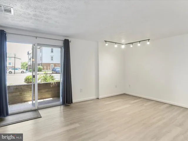 a kitchen with stainless steel appliances granite countertop a stove and a microwave