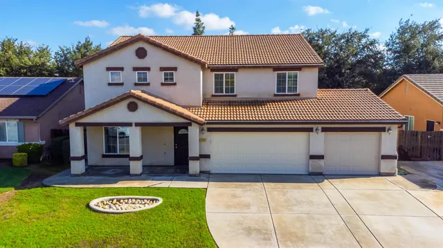 a front view of a house with yard