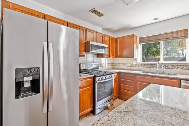 a view of empty room with a fireplace