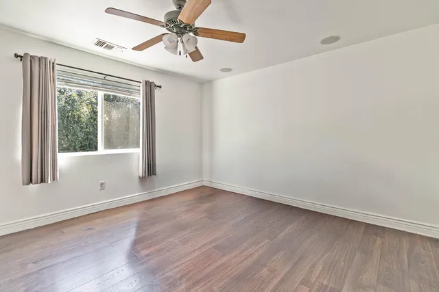 a bathroom with a sink a mirror and a shower