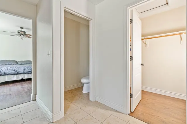 a bathroom with a window and a shower