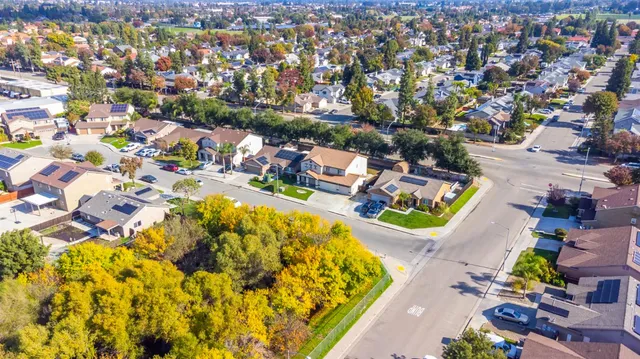 an aerial view of a house with a swimming pool
