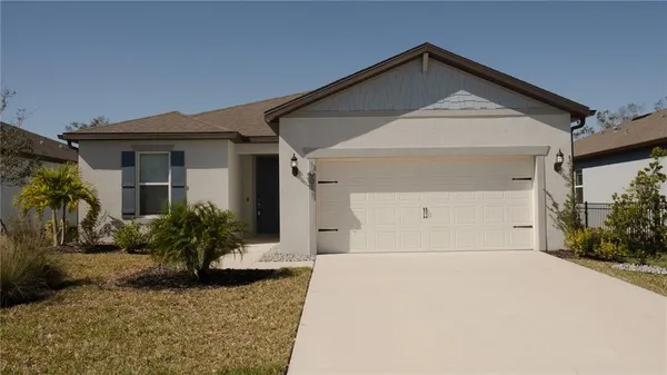 a view of a room with window and wooden floor