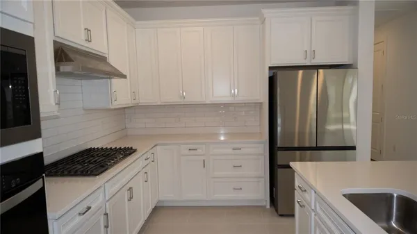 a spacious bathroom with a double vanity sink mirror and double