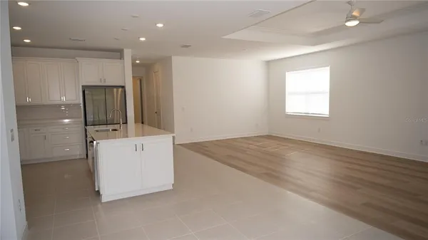 a bathroom with a shower and a glass door