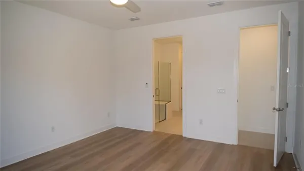 a white bath tub sitting next to a white toilet