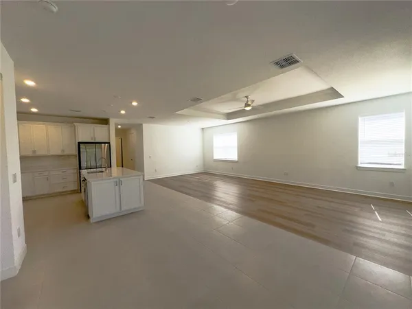 a view of kitchen with cabinets and wooden floor
