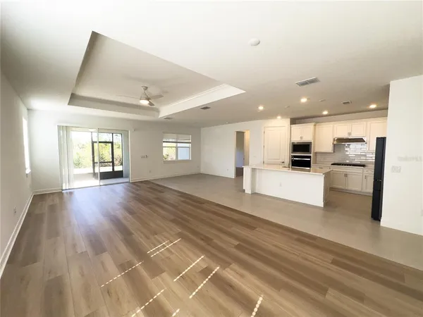 a kitchen with stainless steel appliances a stove a sink and a refrigerator