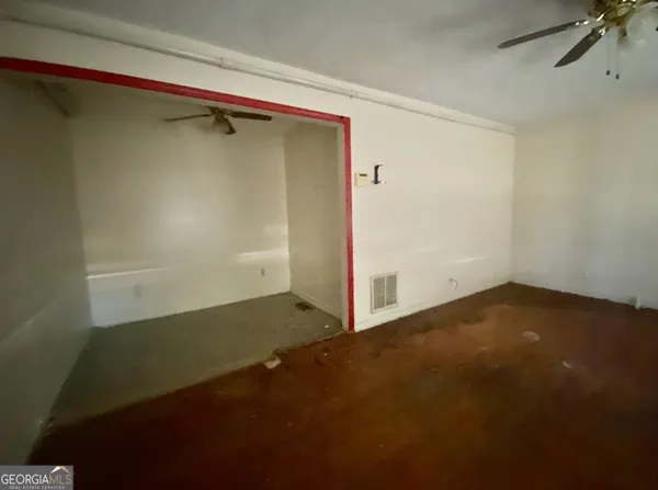 a view of kitchen and empty room